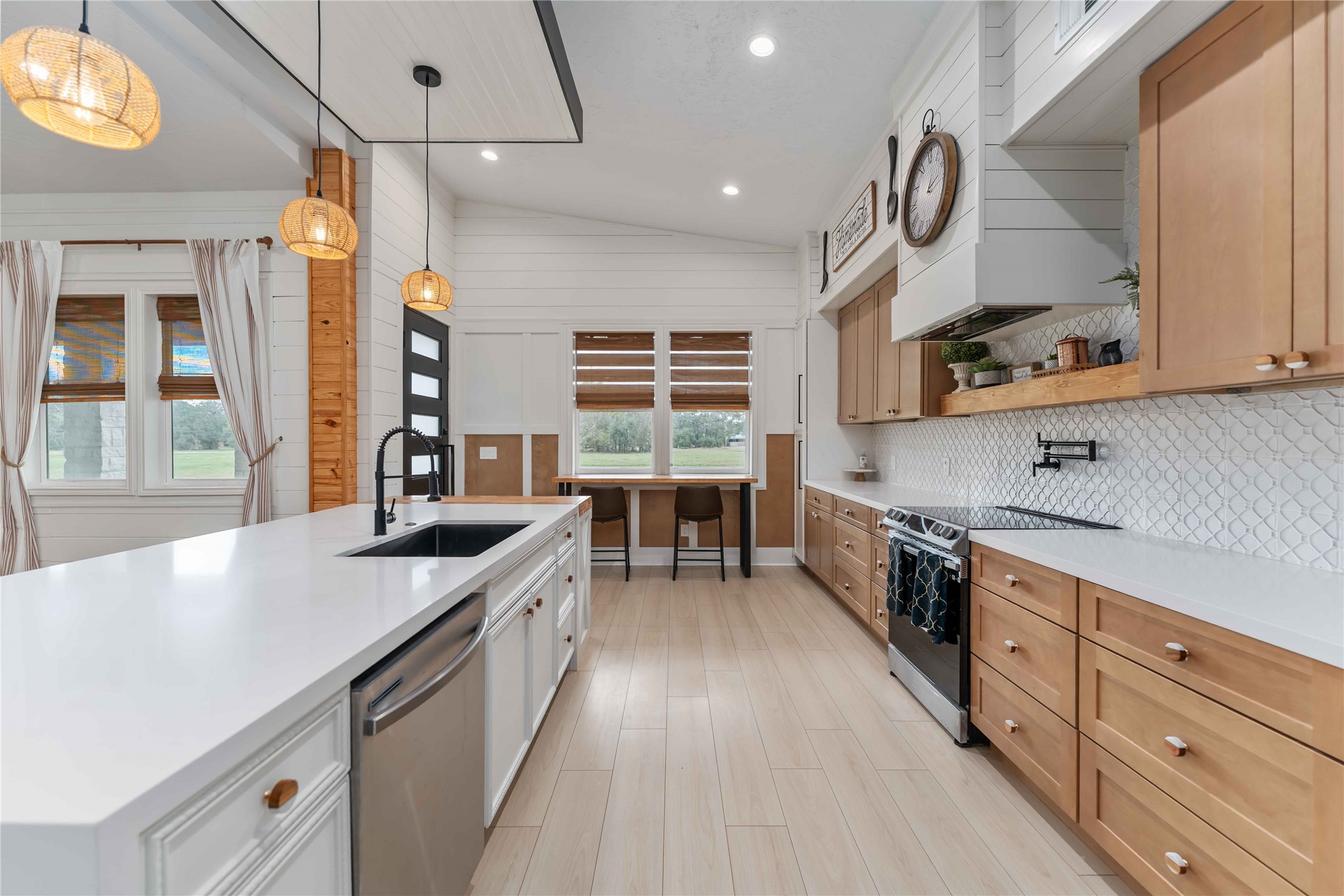 209 Horse Shoe Trail Angleton, TX 77515 - Photo 11 of 43 a kitchen with stainless steel appliances a sink stove and cabinets