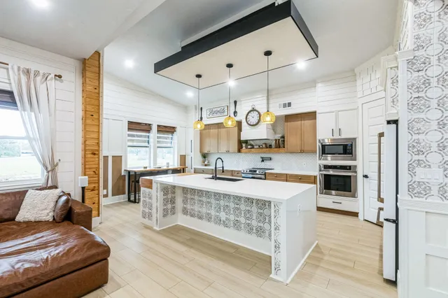 an entryway with fireplace and cabinets