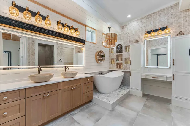a bathroom with a sink and mirror
