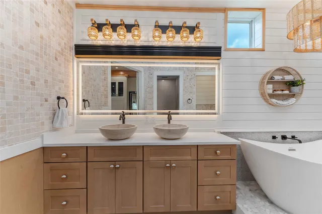 a bathroom with a sink toilet tub and shower