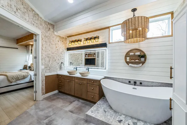 a spacious bathroom with a sink and a mirror