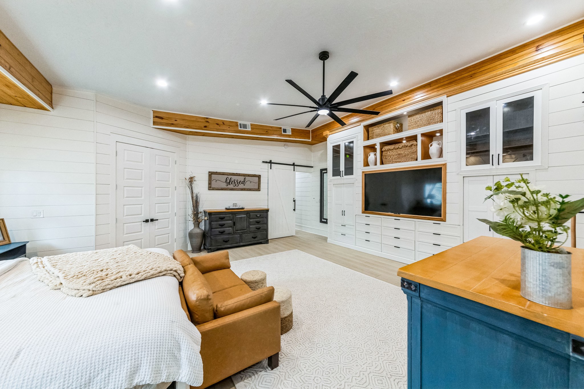 209 Horse Shoe Trail Angleton, TX 77515 - Photo 3 of 43 a spacious bedroom with a bed and a flat screen tv