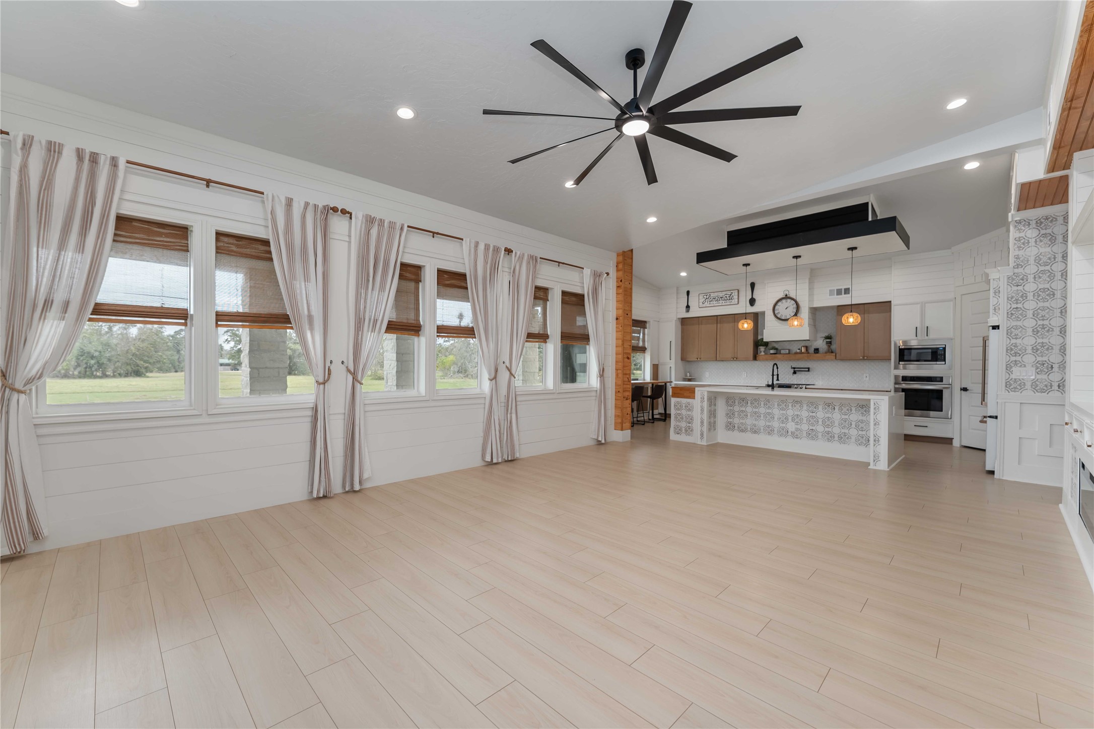209 Horse Shoe Trail Angleton, TX 77515 - Photo 4 of 43 a view of an empty room with furniture and windows