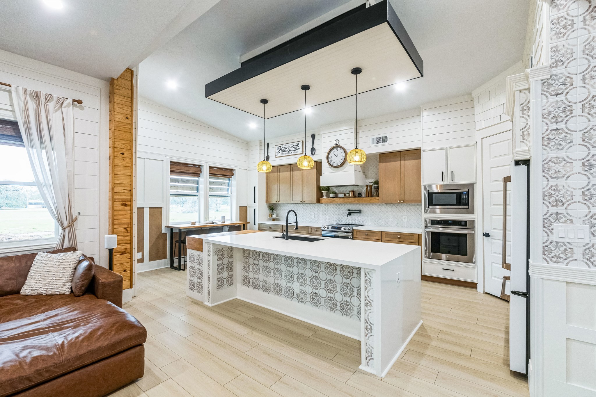 209 Horse Shoe Trail Angleton, TX 77515 - Photo 9 of 43 a large kitchen with a large counter top stainless steel appliances and window