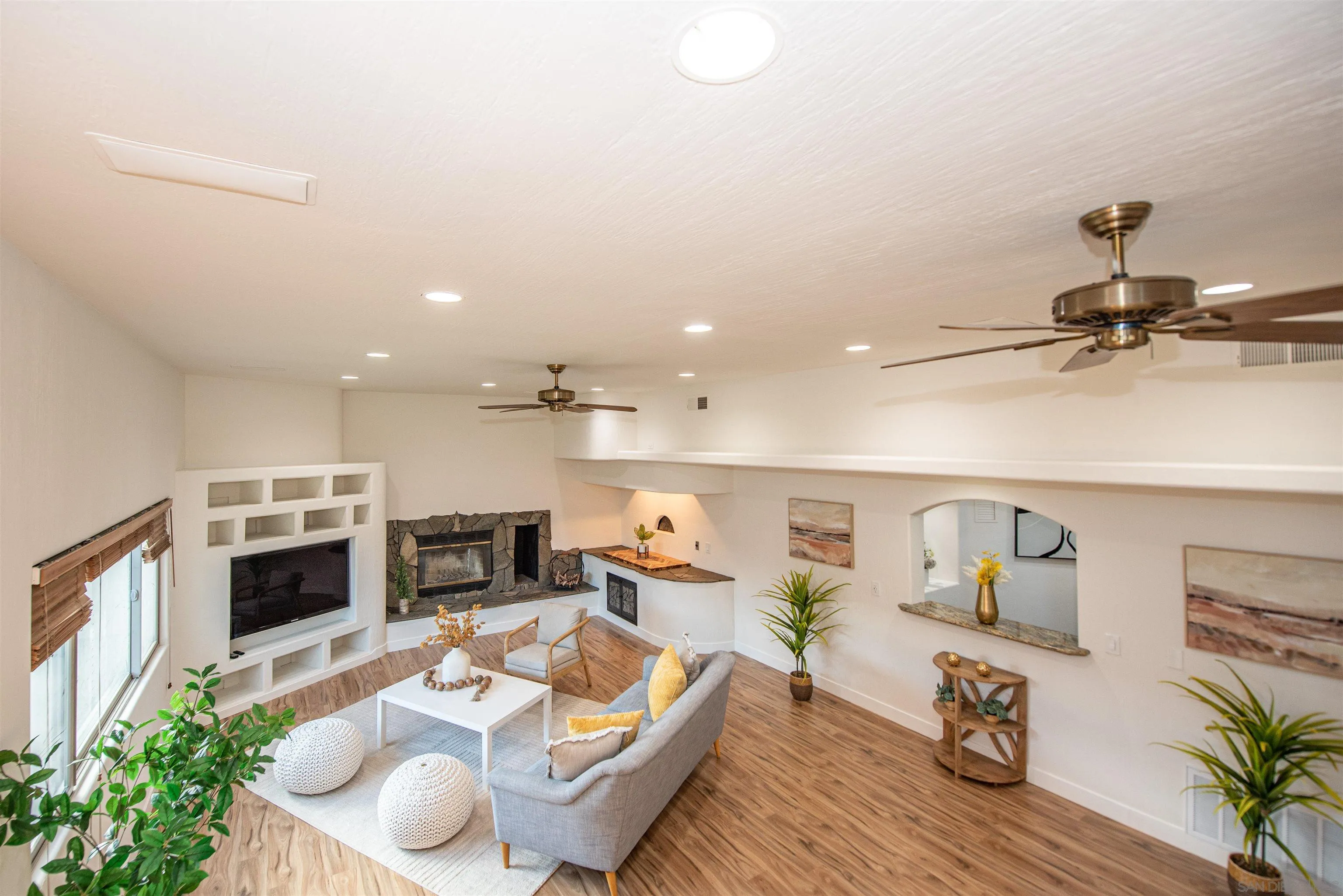 13419 Sebago Avenue Poway, CA 92064 - Photo 20 of 44 a living room with furniture and a fireplace