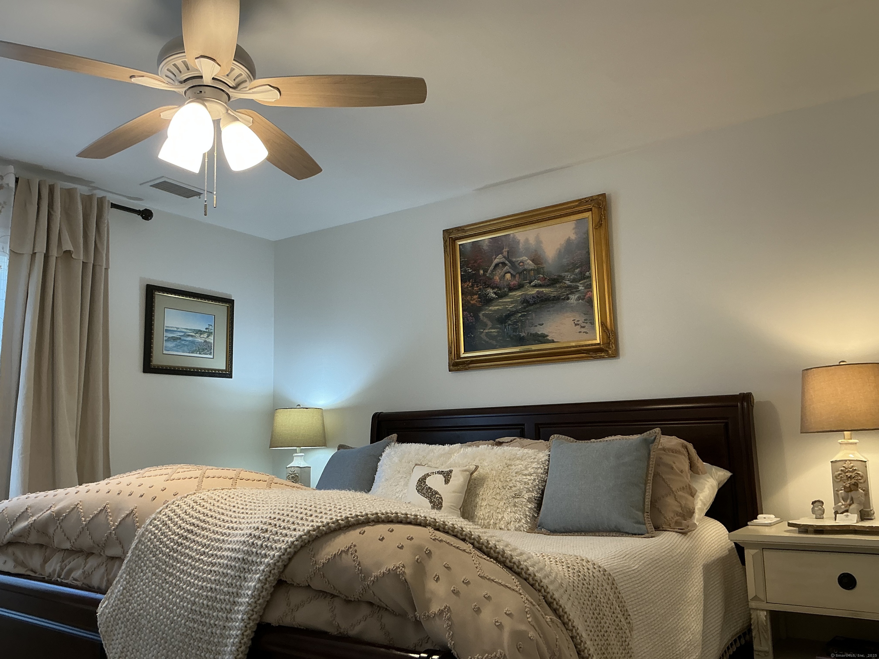 751 Long Hill Road, Unit C Middletown, CT 06457 - Photo 14 of 30 a bedroom with a bed and a chandelier