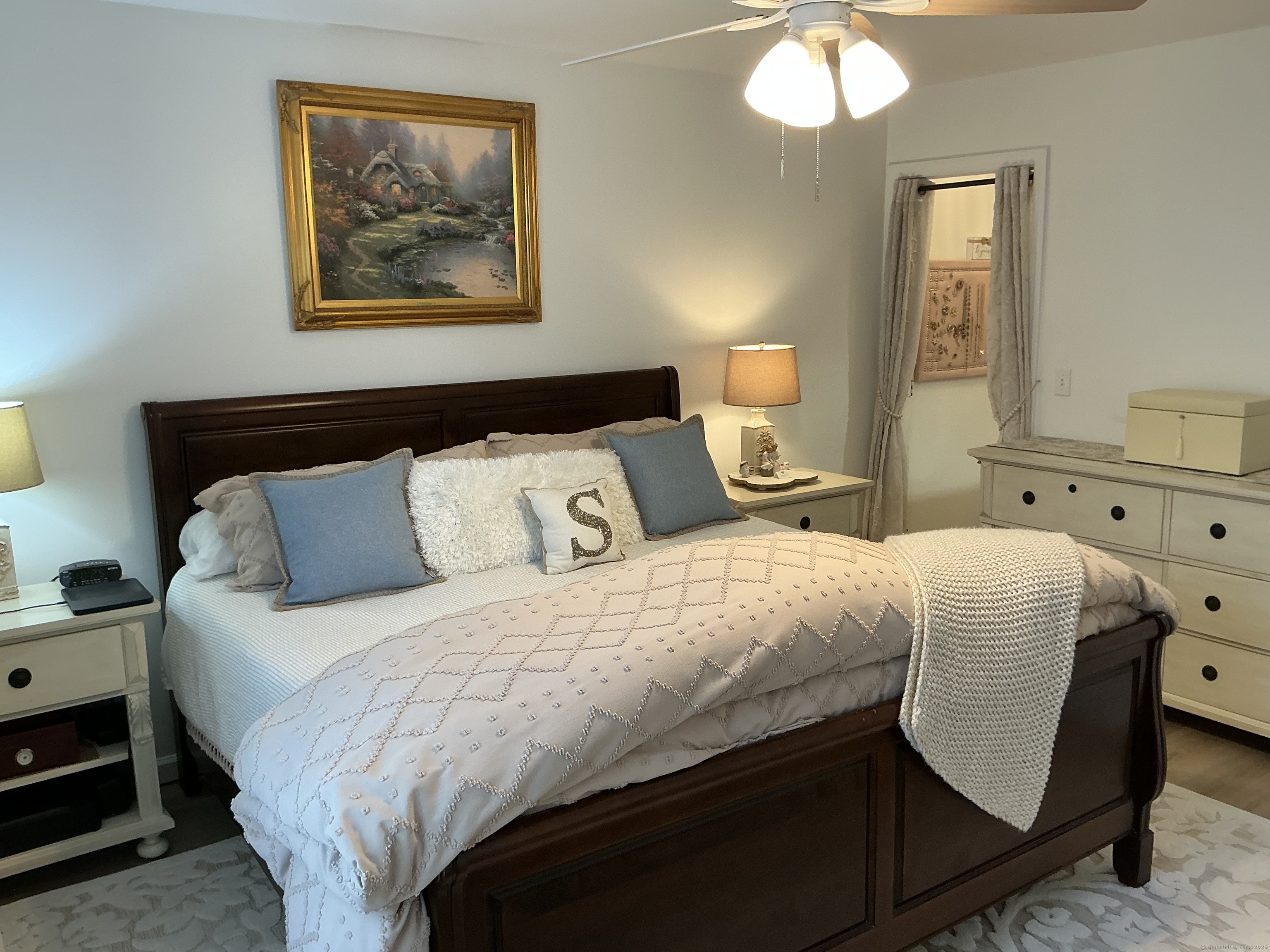 751 Long Hill Road, Unit C Middletown, CT 06457 - Photo 15 of 30 a bedroom with a bed and lamp