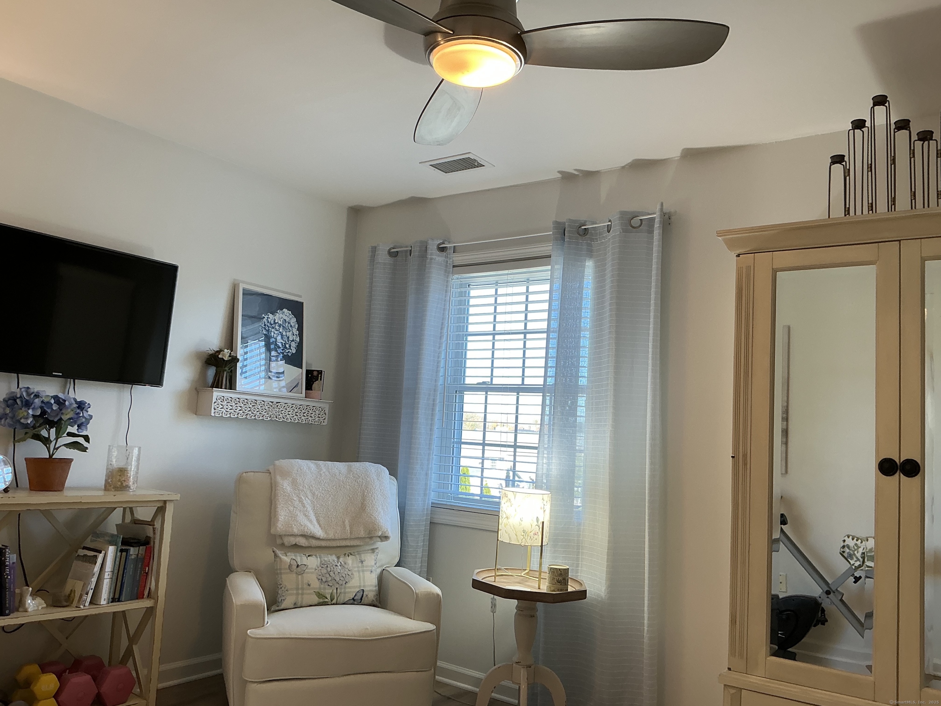 751 Long Hill Road, Unit C Middletown, CT 06457 - Photo 20 of 30 a living room with furniture and a flat screen tv