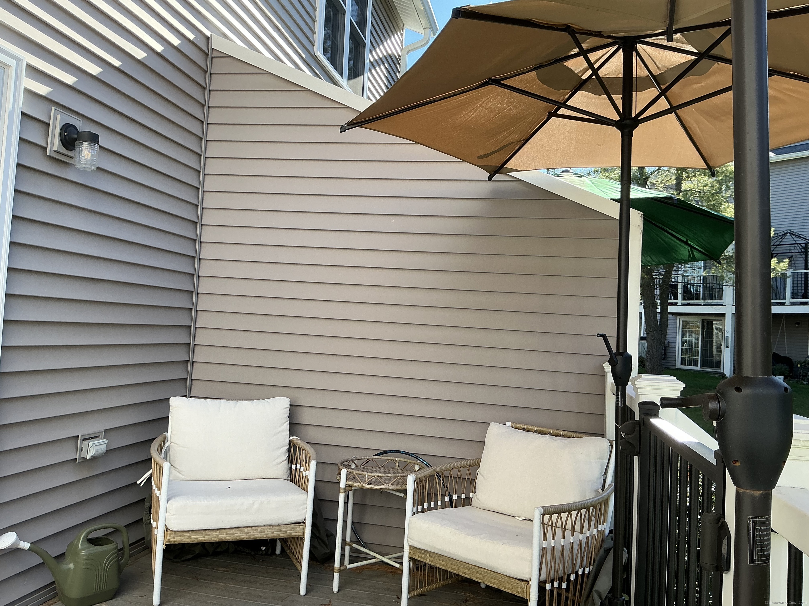 751 Long Hill Road, Unit C Middletown, CT 06457 - Photo 28 of 30 a view of a patio with a table and chairs under an umbrella