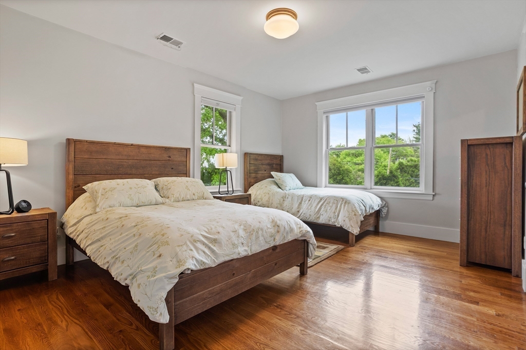 5 Walnut Street Lexington, MA 02421 - Photo 14 of 34 a bedroom with two beds and a window