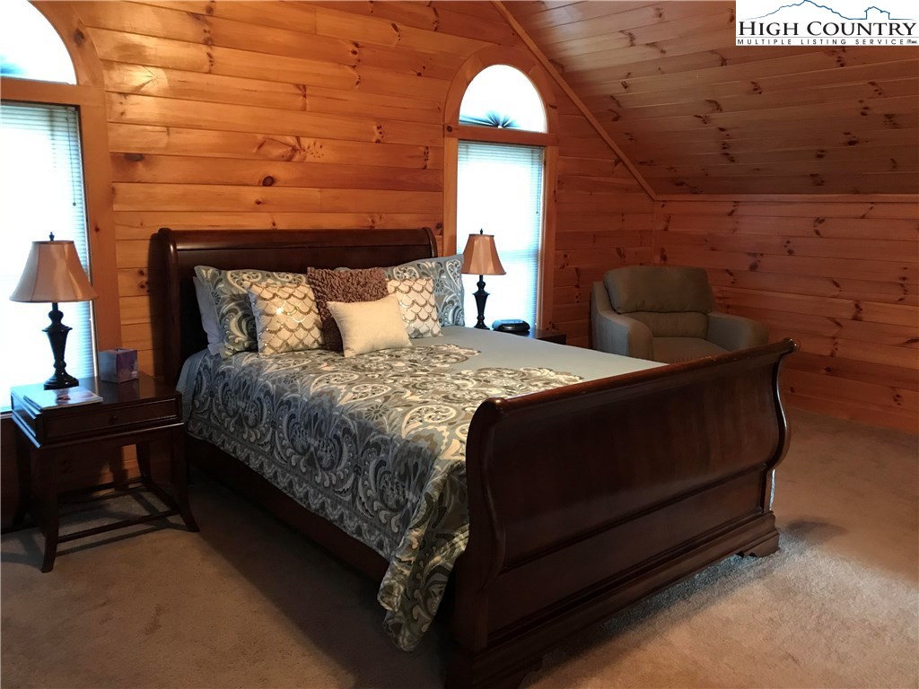 146 Quick Boone, NC 28607 - Photo 12 of 22 a bedroom with a bed wooden floor and window