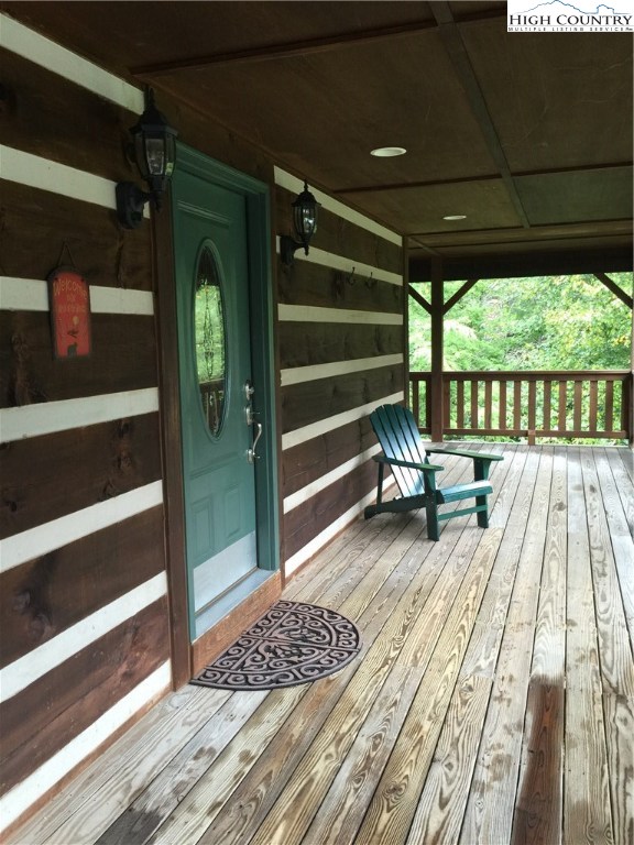 146 Quick Boone, NC 28607 - Photo 4 of 22 a view of balcony with wooden floor and outdoor space
