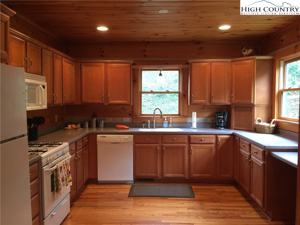 146 Quick Boone, NC 28607 - Photo 8 of 22 a kitchen with a sink window and cabinets