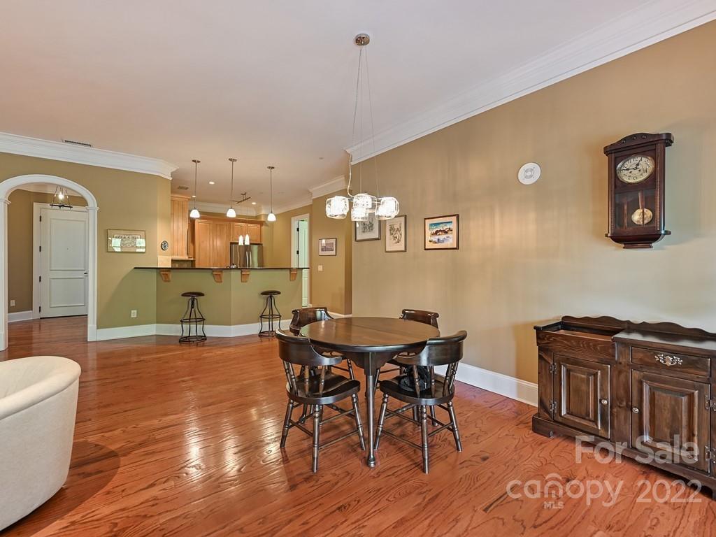 2823 Providence Road, Unit 133 Charlotte, NC 28211 - Photo 12 of 43 a view of a dining room with furniture and wooden floor