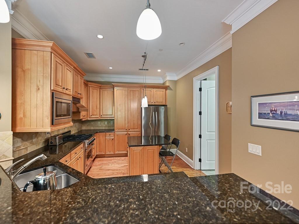 2823 Providence Road, Unit 133 Charlotte, NC 28211 - Photo 14 of 43 a room with lots of chairs and mirrors