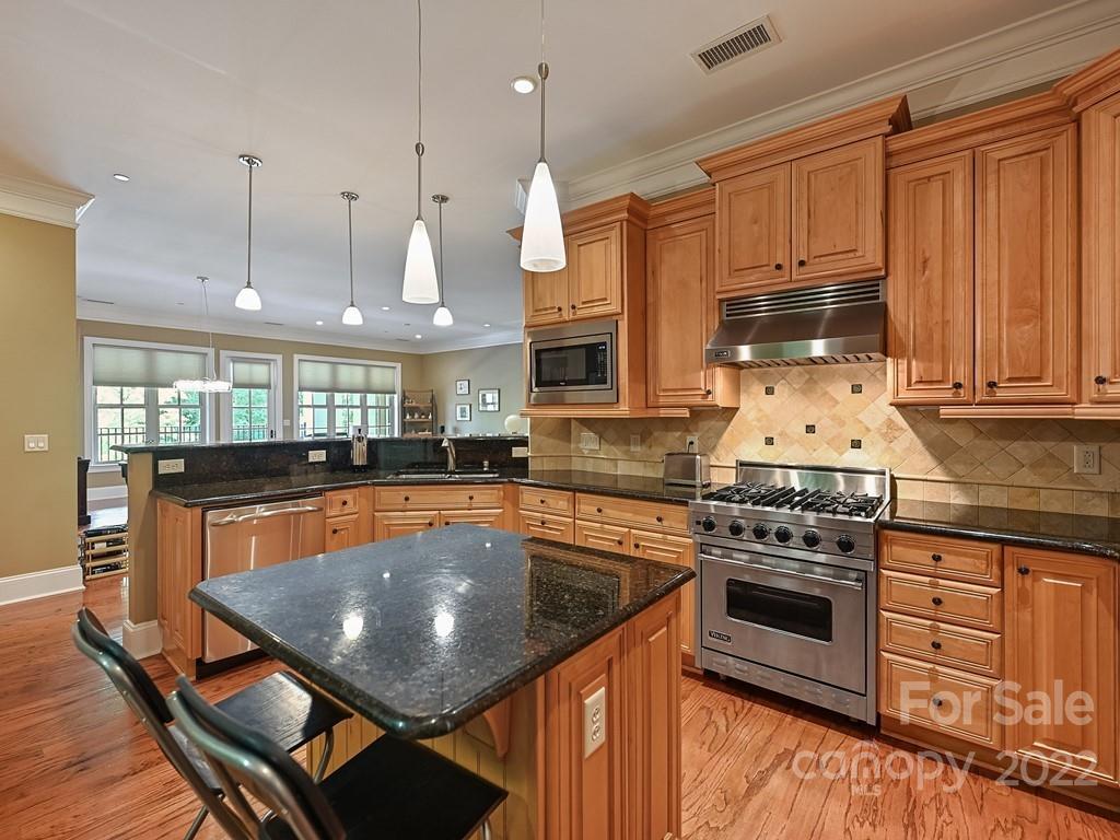 2823 Providence Road, Unit 133 Charlotte, NC 28211 - Photo 17 of 43 a kitchen with stainless steel appliances granite countertop a stove a sink and a refrigerator