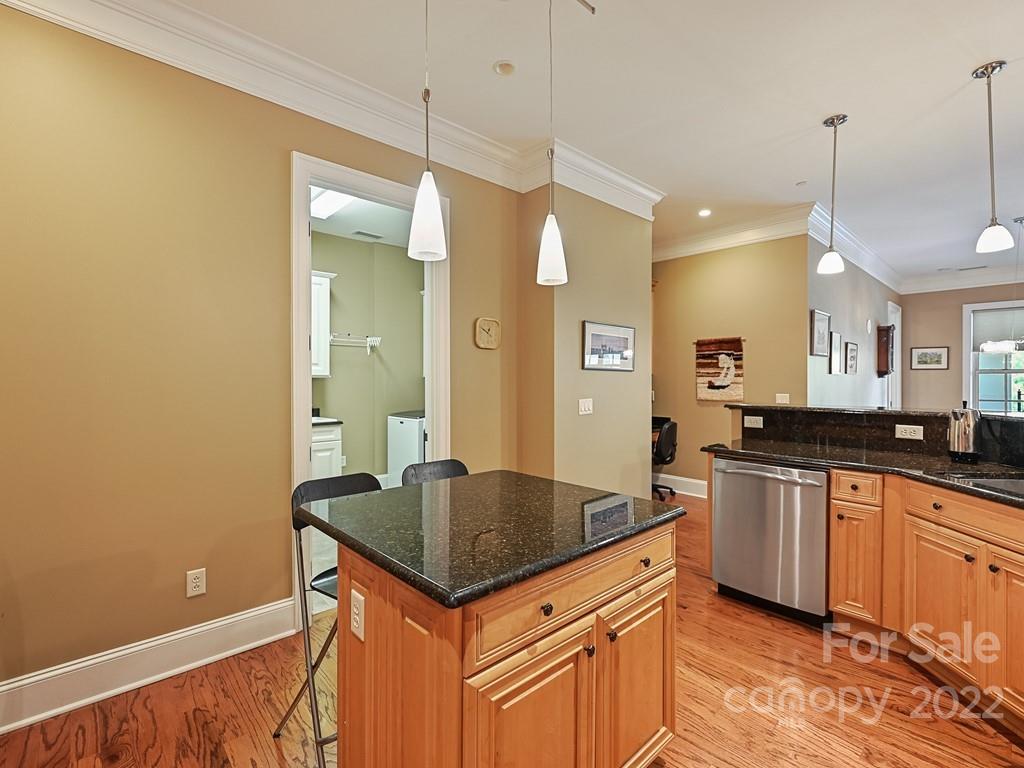 2823 Providence Road, Unit 133 Charlotte, NC 28211 - Photo 18 of 43 a kitchen with stainless steel appliances granite countertop a sink a stove and a wooden floors