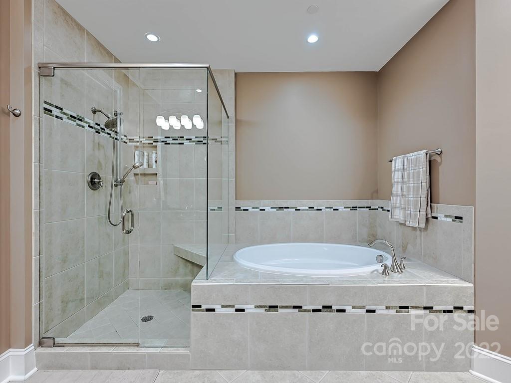 2823 Providence Road, Unit 133 Charlotte, NC 28211 - Photo 21 of 43 a bathroom with a granite countertop sink a mirror and shower
