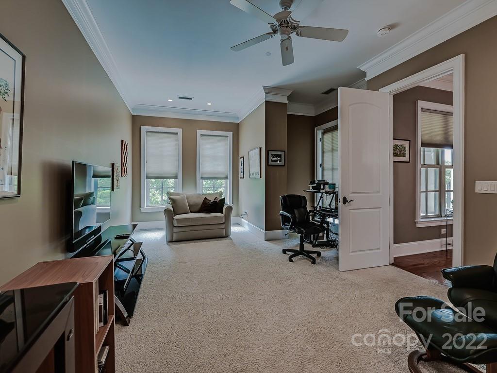 2823 Providence Road, Unit 133 Charlotte, NC 28211 - Photo 23 of 43 a living room with furniture and a flat screen tv