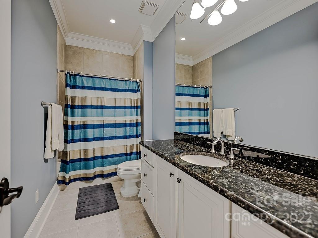 2823 Providence Road, Unit 133 Charlotte, NC 28211 - Photo 25 of 43 a bathroom with double vanity and a mirror