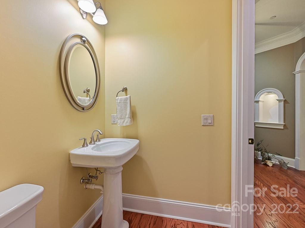 2823 Providence Road, Unit 133 Charlotte, NC 28211 - Photo 5 of 43 a bathroom with a sink mirror vanity and toilet