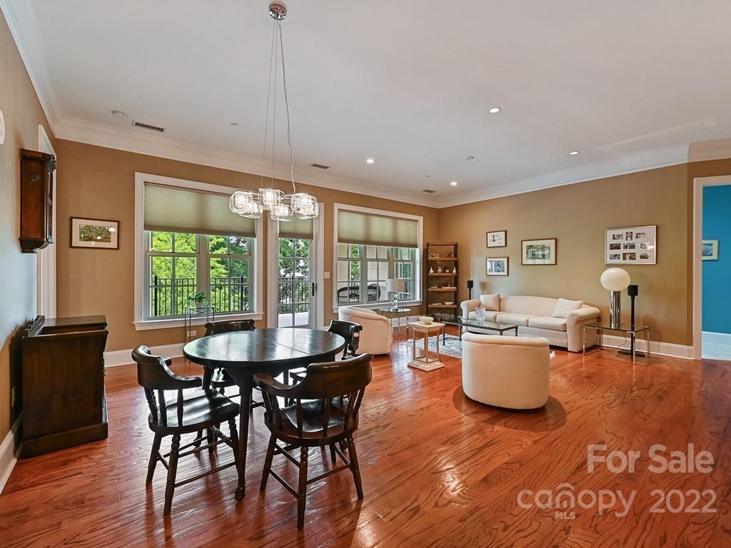 2823 Providence Road, Unit 133 Charlotte, NC 28211 - Photo 7 of 43 a dining room with furniture window and wooden floor