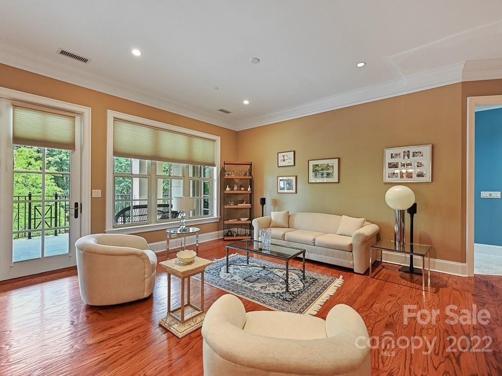 2823 Providence Road, Unit 133 Charlotte, NC 28211 - Photo 8 of 43 a living room with furniture and a large window