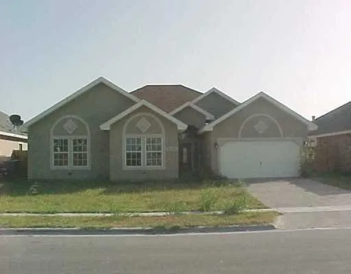 a view of front a house with a yard