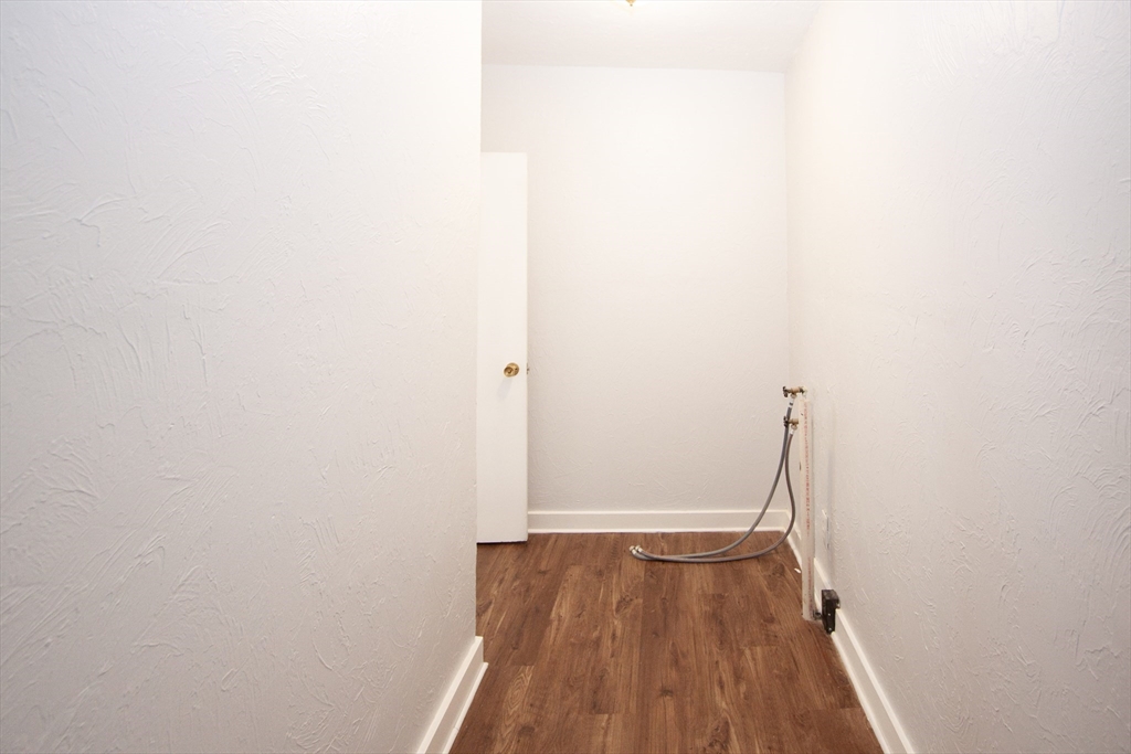 66 Cutler Street Worcester, MA 01604 - Photo 15 of 27 a view of a room with wooden floor