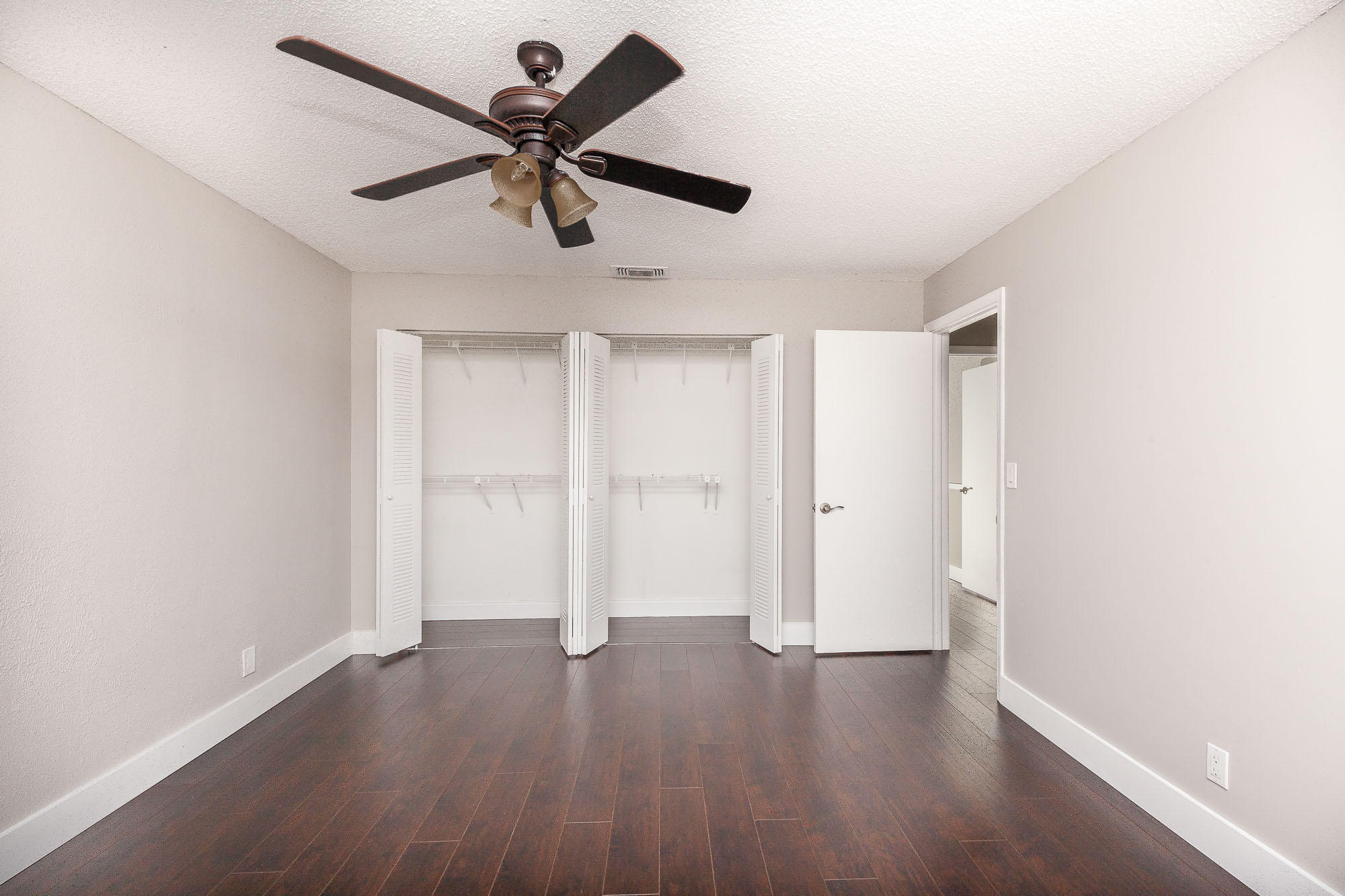 9868 Liberty Road Boca Raton, FL 33434 - Photo 12 of 22 a view of an empty room with wooden floor