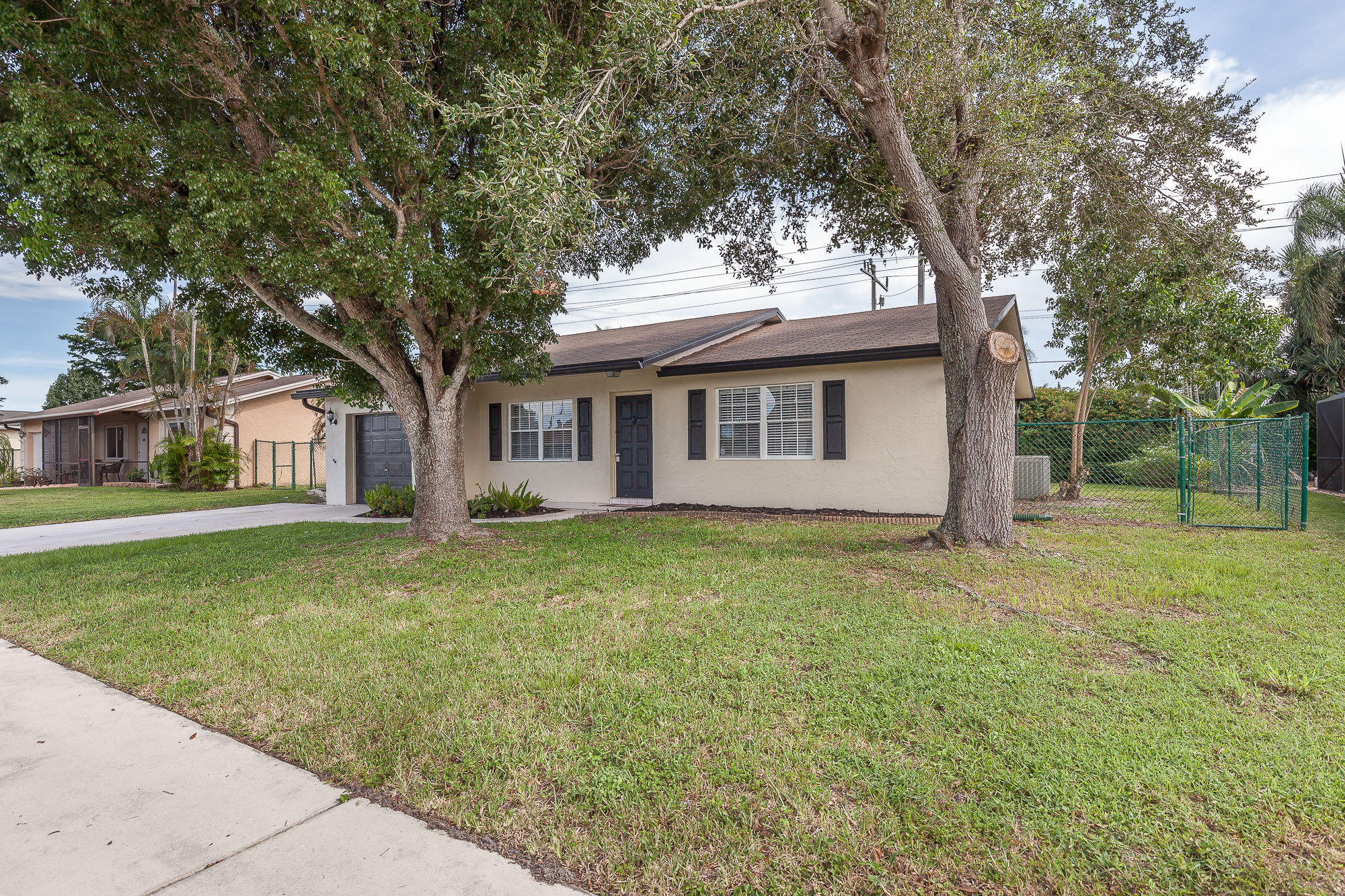 9868 Liberty Road Boca Raton, FL 33434 - Photo 3 of 22 a view of a house with a backyard