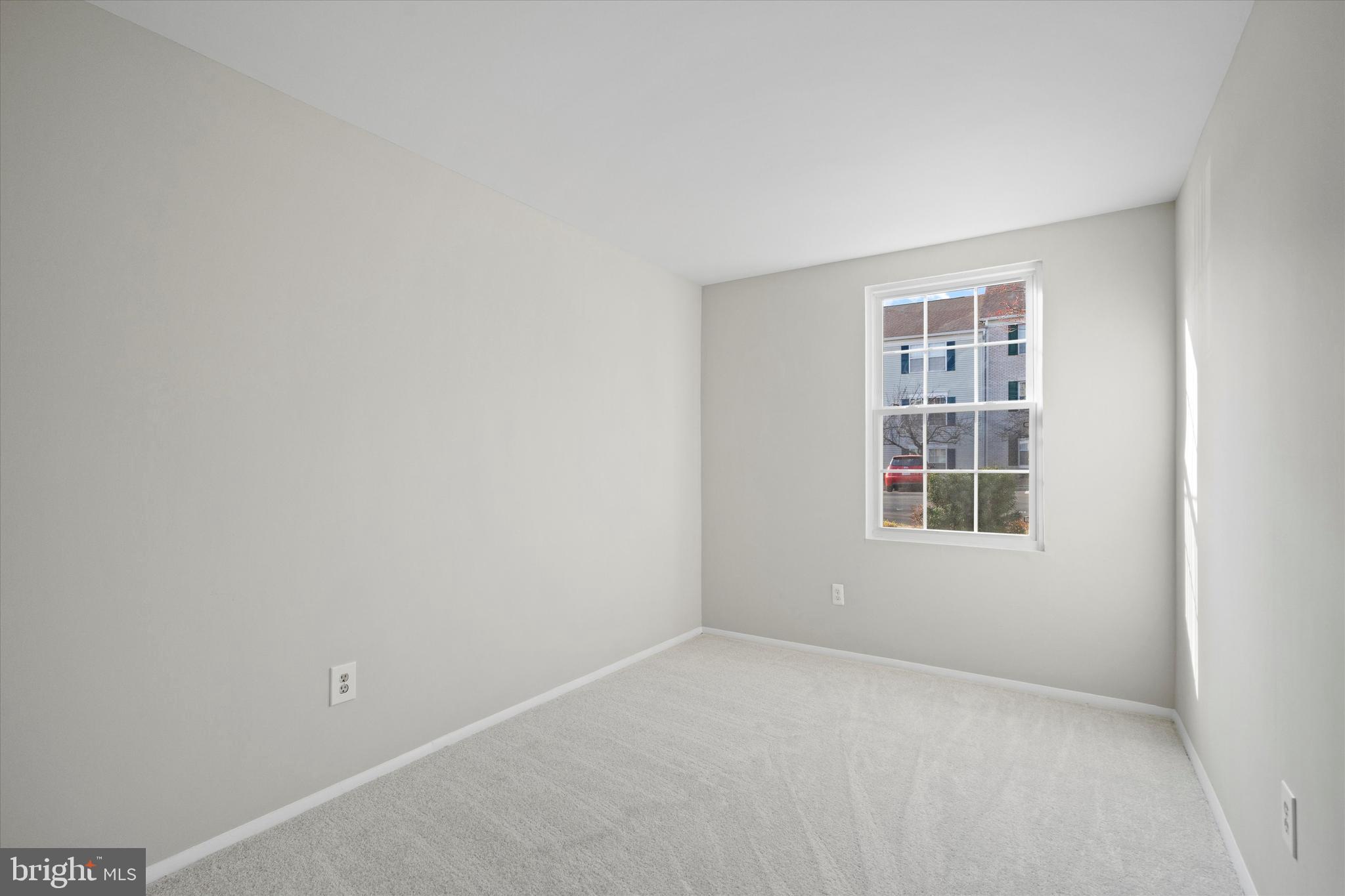 129 Fort Evans Road Southeast, Unit A Leesburg, VA 20175 - Photo 23 of 33 an empty room with a window