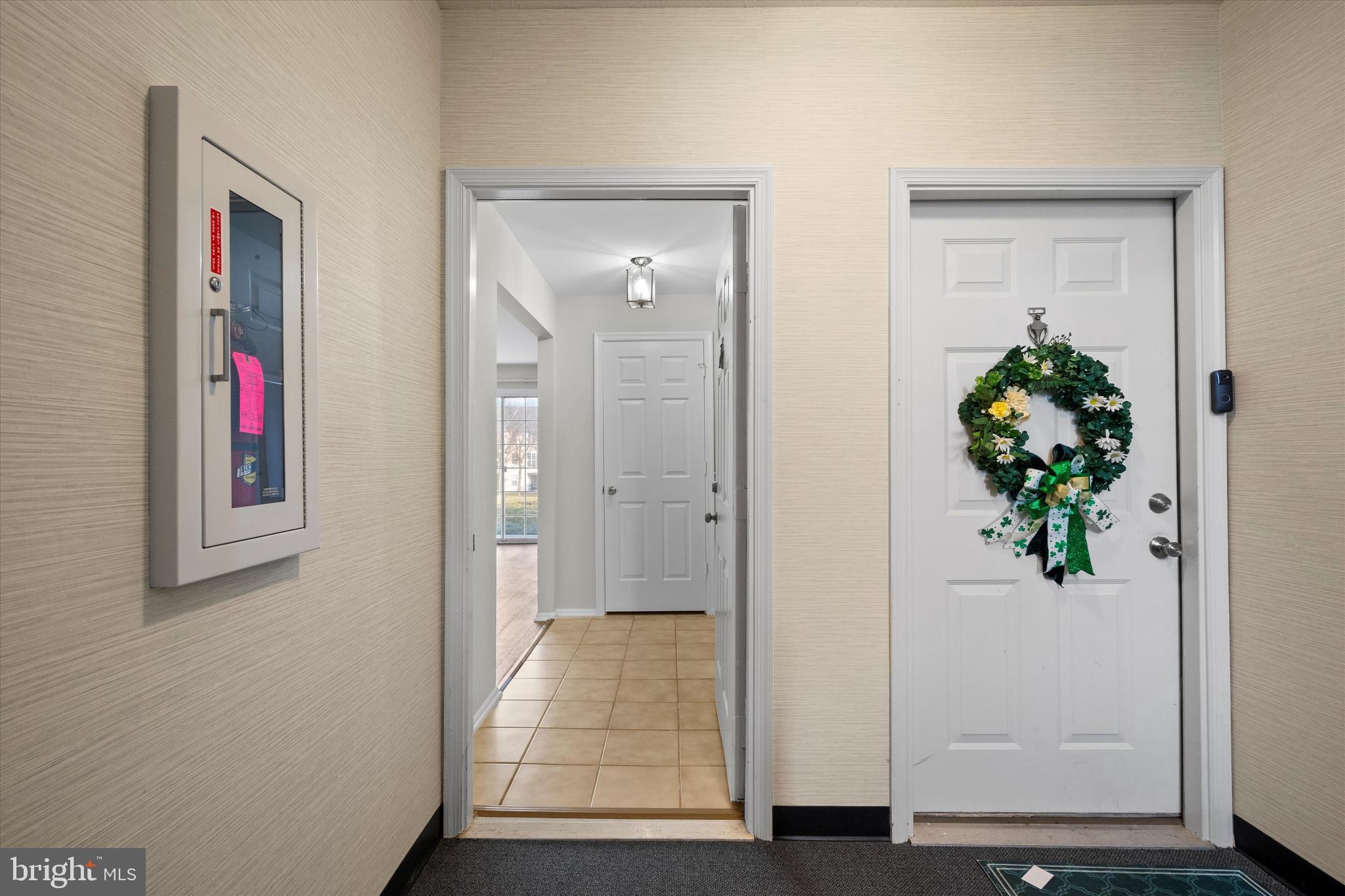 129 Fort Evans Road Southeast, Unit A Leesburg, VA 20175 - Photo 26 of 33 a view of a hallway with wooden floor and closet