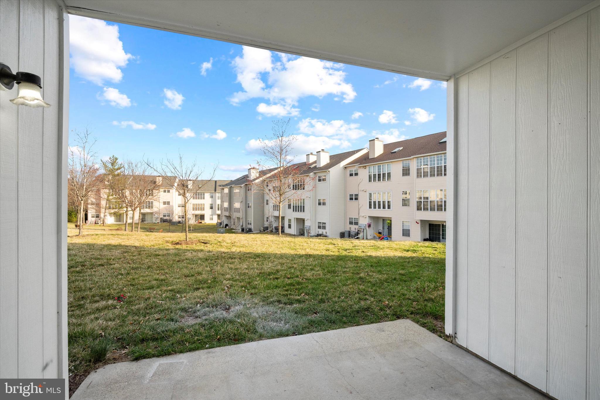 129 Fort Evans Road Southeast, Unit A Leesburg, VA 20175 - Photo 27 of 33 a view of a large building with a big yard
