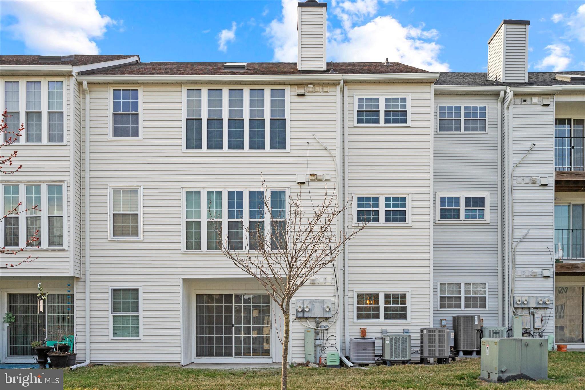 129 Fort Evans Road Southeast, Unit A Leesburg, VA 20175 - Photo 28 of 33 a front view of a house with a yard