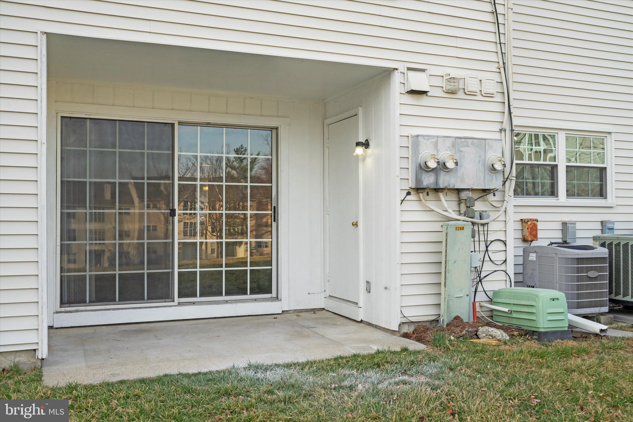 129 Fort Evans Road Southeast, Unit A Leesburg, VA 20175 - Photo 29 of 33 a front view of a house with a yard