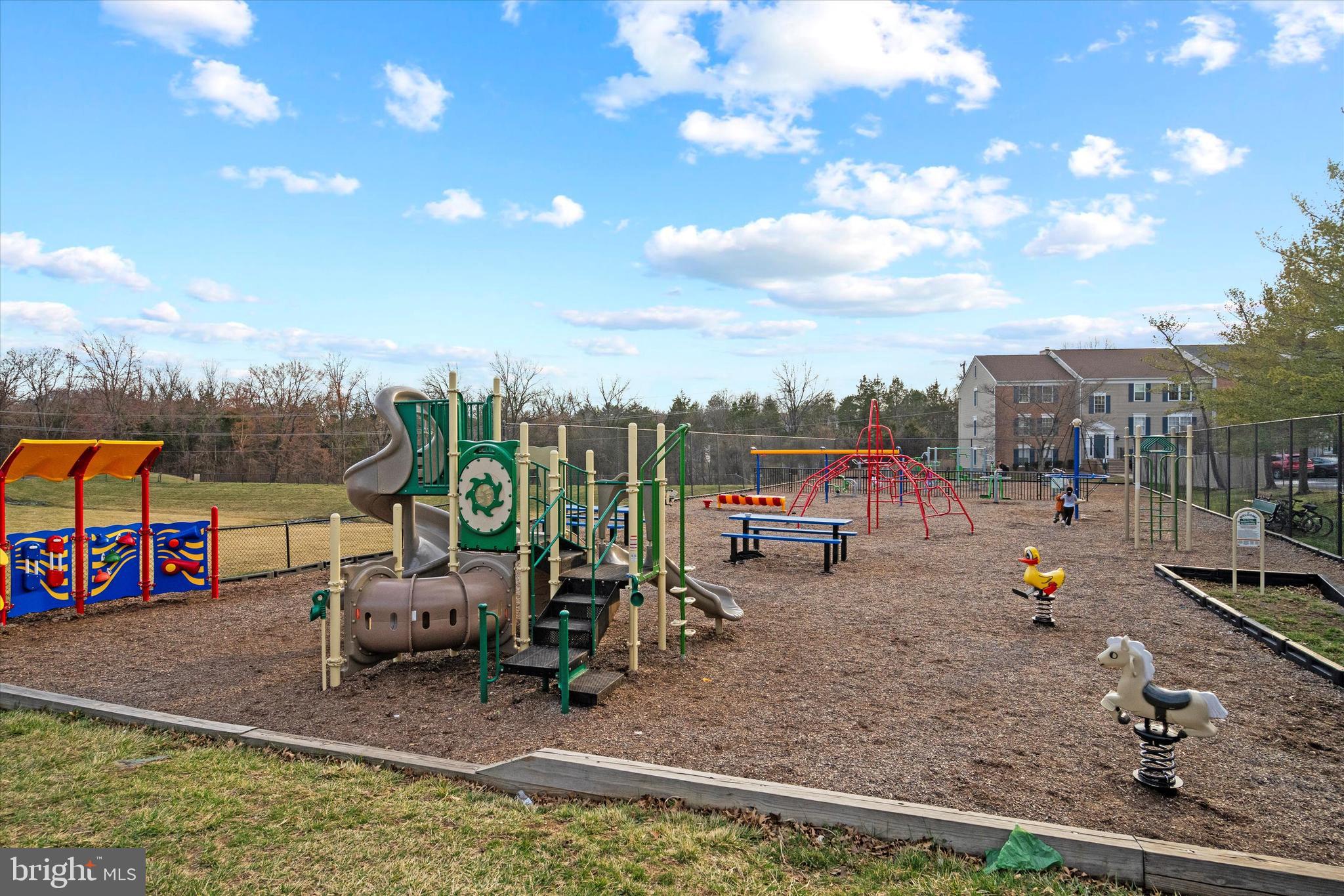 129 Fort Evans Road Southeast, Unit A Leesburg, VA 20175 - Photo 31 of 33 a view of a swimming pool with a patio and a garden