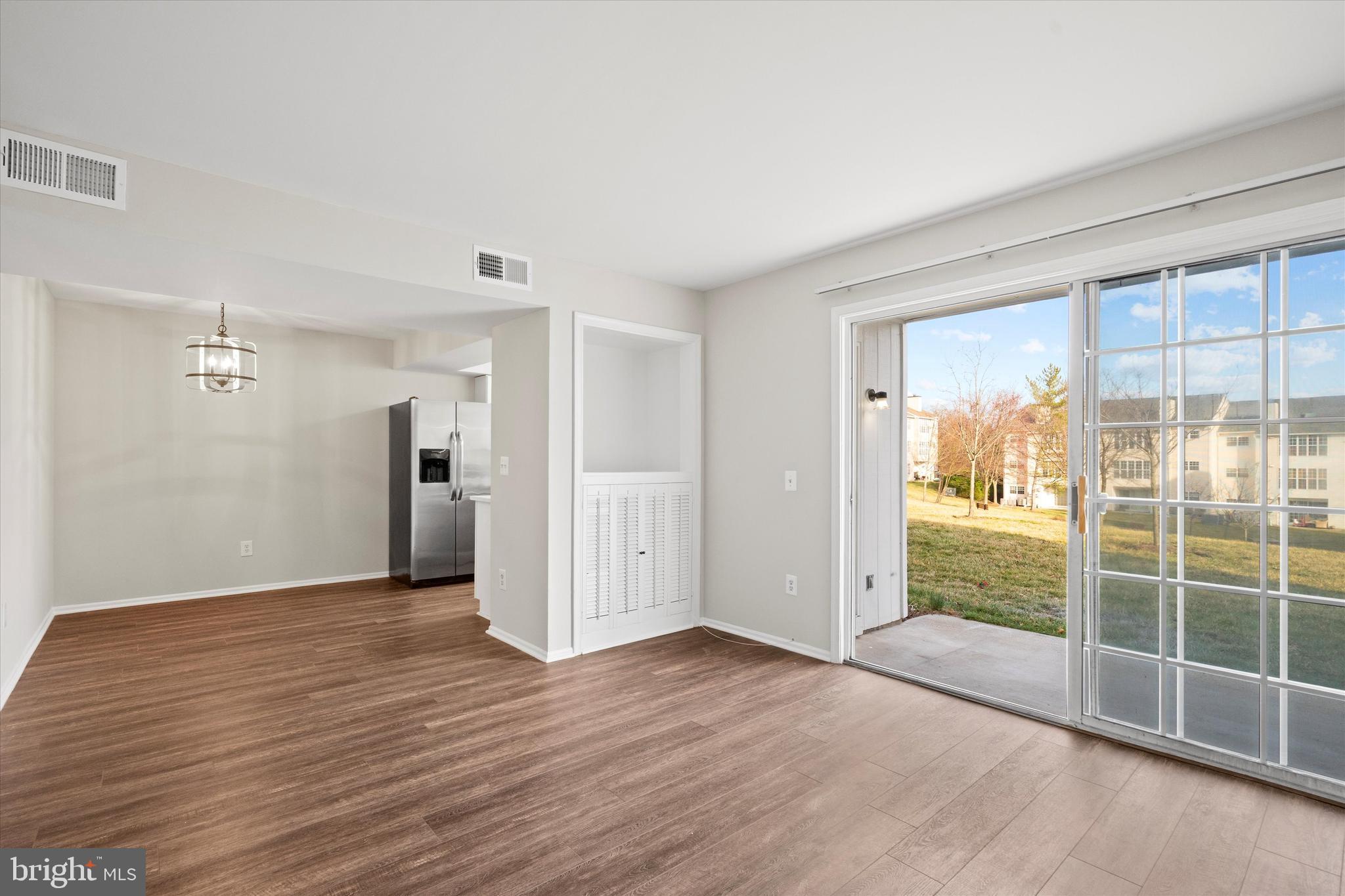129 Fort Evans Road Southeast, Unit A Leesburg, VA 20175 - Photo 6 of 33 a view of a room with a large window