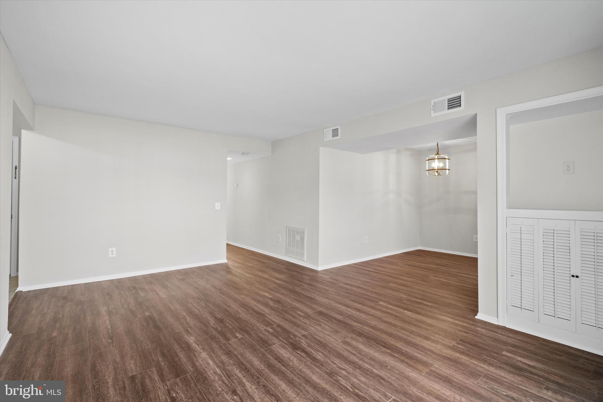 129 Fort Evans Road Southeast, Unit A Leesburg, VA 20175 - Photo 9 of 33 a view of an empty room with wooden floor