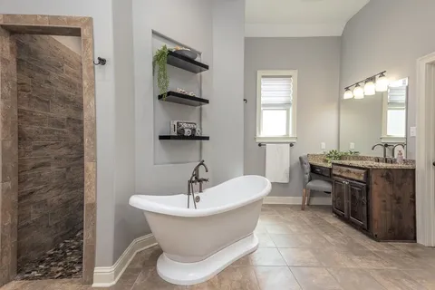 a bathroom with a sink a toilet and bathtub