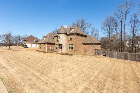 a view of a house with a snow in the yard