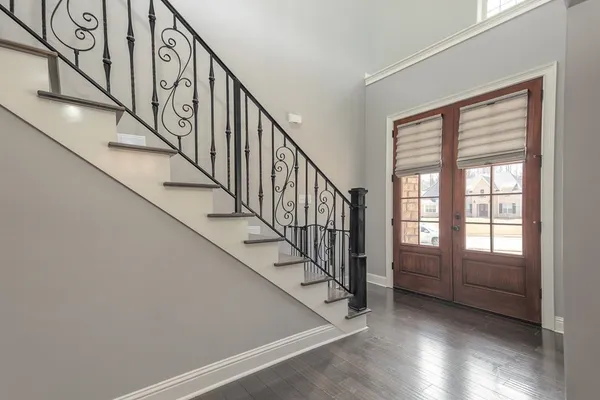 a view of an entryway with wooden floor