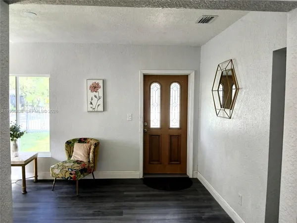 a view of livingroom with furniture and wooden floor