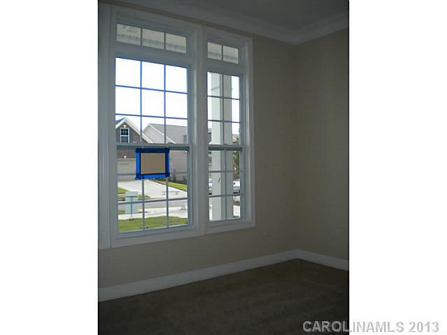 78014 Rillstone Drive, Unit 184 Lancaster, SC 29720 - Photo 4 of 16 a view of an empty room with a window