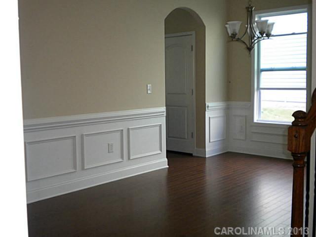 78014 Rillstone Drive, Unit 184 Lancaster, SC 29720 - Photo 7 of 16 a view of a livingroom with wooden floor and window