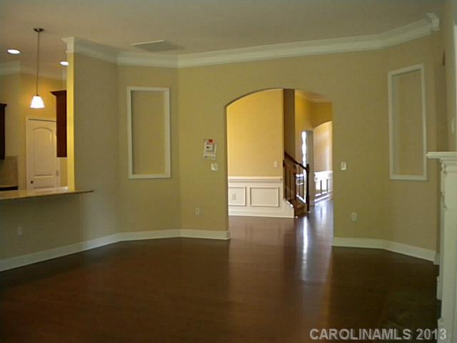 78014 Rillstone Drive, Unit 184 Lancaster, SC 29720 - Photo 9 of 16 a view of empty room with wooden floor