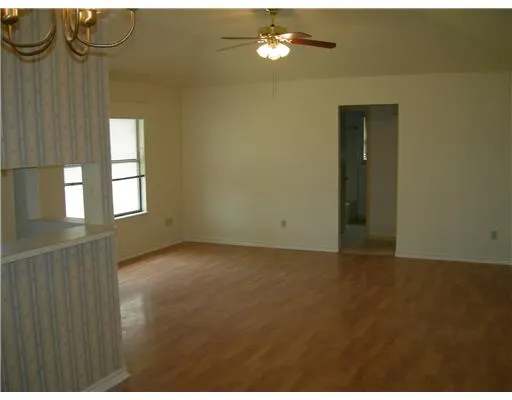 a view of empty room with windows