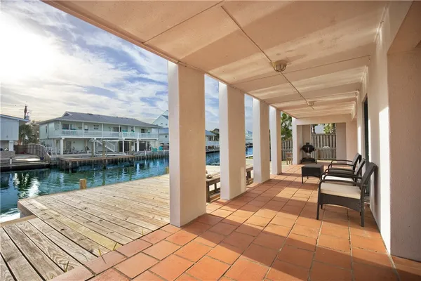 a bedroom with two beds and a chandelier