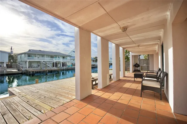 a bedroom with two beds and a chandelier