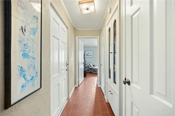 a bathroom with a granite countertop sink a toilet and a mirror